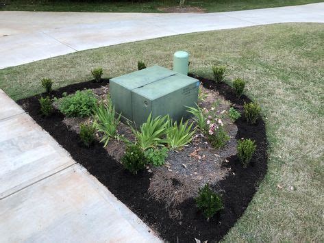 decoration near electric boxes|landscape around electrical boxes.